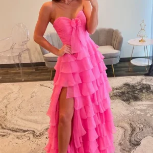 Pink bow at the top - ruffled outfit